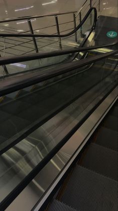 an escalator in a subway station with people on it