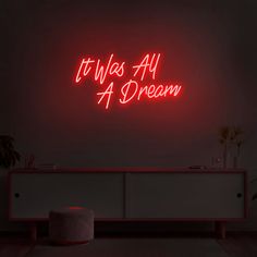 a neon sign that says it was all a dream