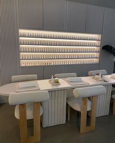 a long table with four chairs around it