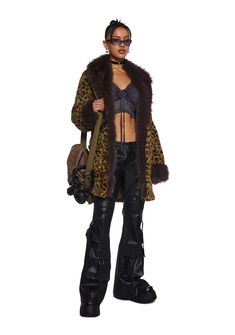 This fully lined coat has a soft faux fur construction with a leopard print design, long faux fur trim, square front pockets, and front button closures. Leopard Print Fur Coat, Leopard Print Faux Fur Coat, Dolls Kill Outfits, Long Sleeve Lace Top, Rocker Outfit, Rave Fits, Fluffy Jacket, Fabulous Furs, Exposed Seams