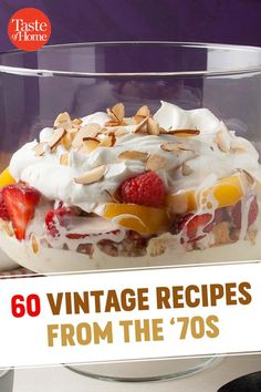 a dessert dish with fruit, nuts and whipped cream in a glass bowl on a table