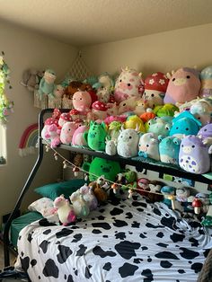 a bunk bed filled with lots of stuffed animals