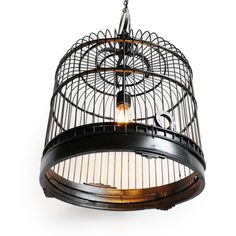 a bird cage hanging from the ceiling with two lights on it's sides and one light in the middle