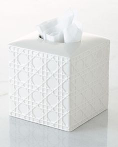 a tissue dispenser sitting on top of a table