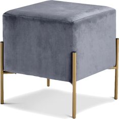 a blue velvet stool with wooden legs on an isolated white background for use as a footstool