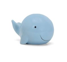 a blue whale toy sitting on top of a white surface