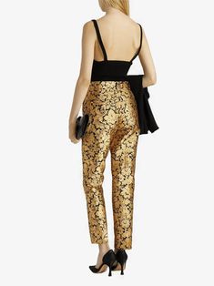 Cut for a tailored silhouette with pressed creases, these Dolce & Gabbana Metallic Jacquard Pants are designed to create bold, timeless look. The soft fabric is accented shimmering gold that adds an elegant finish. Zipper and button-closure pockets lend contemporary edge this chic design.Material: 83% Polyester 17% FiberZipper button closureLogo detailsMade in Italy Model 175cm/ 5'9" wearing IT 40Designed slim fit, tapered at hemFits true size, take your normal size IT42 Measurements:Waist: 74 c Silk Tapered Leg Bottoms For Evening, Elegant Silk Bottoms For Festive Season, Elegant Sequined Bottoms For Gala, Elegant Silk Pants With Tapered Leg, Gold Formal Bottoms, Elegant Festive Pants, Luxury Sequined Pants For Evening, Luxury Sequined Evening Pants, Luxury Sequin Pants For Evening Wear