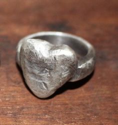 Handmade 925 sterling silver distressed heart ring. Hammered and oxidised with a satin finish. The heart is approximately 18mm x 18mm.  3 sizes available. P, Q, R1/2.  All the rings are cast from the same piece, but because of the method used each ring will have it's own individual markings. Approx weight from 16g - 20g. Hallmarked. Finish The Heart, Handmade Silver Rings, Art Clay Silver, Nail Jewels, Handmade Silver Ring, Ring Heart, Dope Jewelry, Casting Jewelry, Classy Jewelry