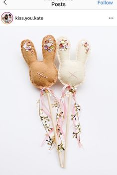 two bunny lollipops are sitting on top of each other