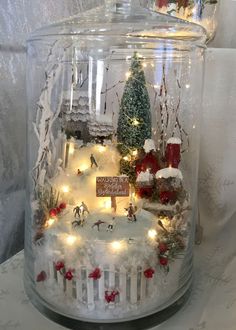 a glass jar filled with christmas decorations and lights