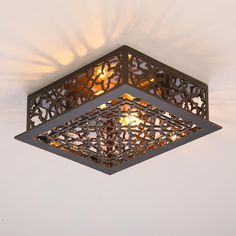 a square light fixture hanging from the ceiling