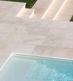 an aerial view of a swimming pool and steps