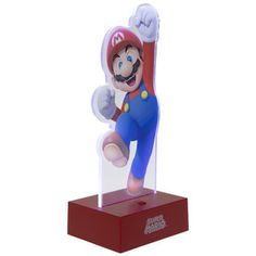 a nintendo figurine that is on top of a red stand with its arms up