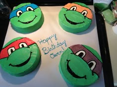 four teenaged ninja turtles on top of green cupcakes with happy birthday written on them