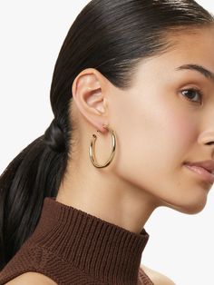 You can never go wrong with this pair of gold hoop earrings with a high-polish texture and hypoallergenic titanium posts. Carefully crafted and dipped in 14k gold, these classic gold hoops are meant to be worn every single day by a confident and chic woman. Score bonus styling points by pairing these gold hoop earrings with a thin gold collar. • Versatile & timeless gold hoops• Coated with a thick 14k gold layer & feature hypoallergenic titanium posts • Comfortable to wear all day long Round Earring, Detailed Jewelry, Solid Gold Earrings, Classic Gold, Silver Pieces, Gold Hoops, Round Earrings, Gold Hoop, Silver Hoops