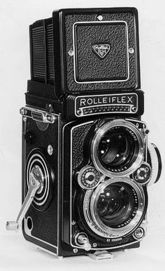 an old fashioned camera is shown in black and white