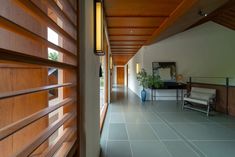 the hallway is lined with wooden slats