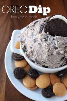 an oreo dip on a plate with cookies and crackers