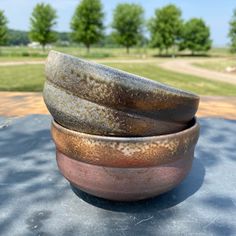 three bowls are stacked on top of each other