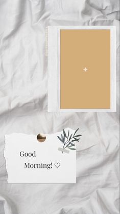 a white sheet with a note that says good morning and an olive branch on it