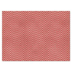 a red and white rug with an abstract pattern