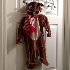 a stuffed animal hanging on the front door