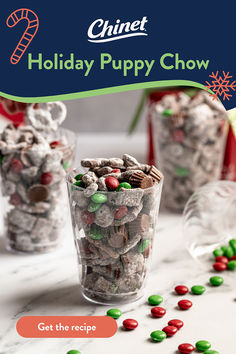 the holiday puppy chow recipe is shown in front of two small cups filled with candy