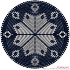 a blue and white doily with flowers on it's center, in the shape of a circle