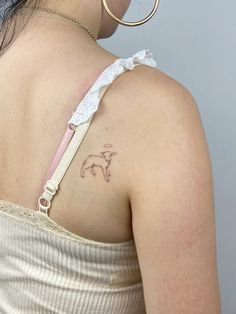 a woman with a small tattoo on her back