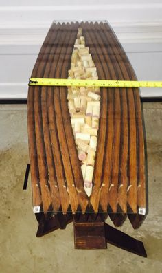 a wooden table that has some kind of food on it with tape around the edge