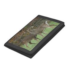 two deer running through the woods wallets