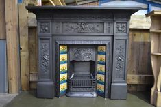 an ornate fireplace in the middle of a room