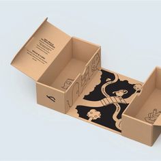 an open cardboard box with cartoon drawings on the side and inside, sitting on a white surface