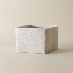 a white square container sitting on top of a table