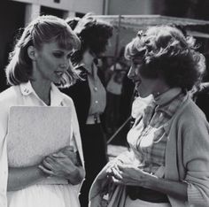 black and white photograph of two women talking to each other