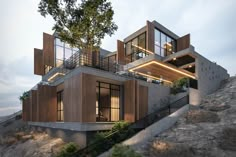 a house on top of a hill with stairs leading up to the roof and windows