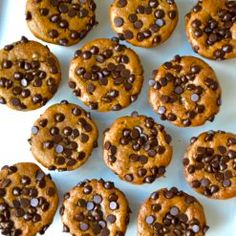 chocolate chip cookies are arranged on a white platter, ready to be eaten and served