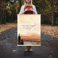 a woman holding up a sign that says, when you want to be in the wilderness