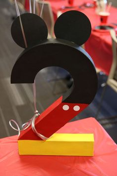 a mickey mouse head cut out on top of a table