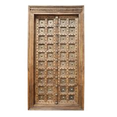 an old wooden door with intricate carvings on it