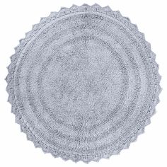 a round rug is shown on a white background, with the center circle made out of crochet