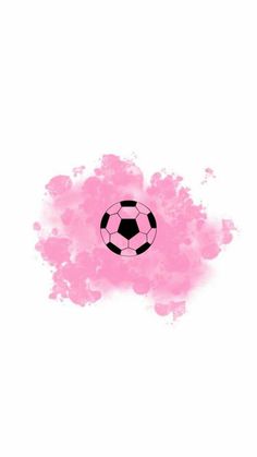 a soccer ball painted in pink and black on a white background with watercolor stains