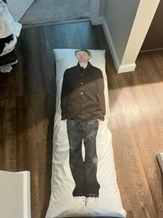 a person laying on a bed with an image of him in the middle of it