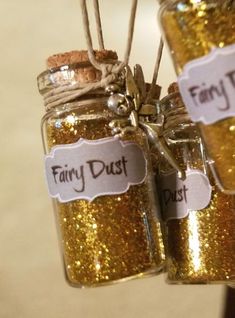 gold glitter jars with fairy dust tags on them