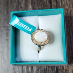 an open box with a ring in it