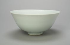 a white bowl sitting on top of a table