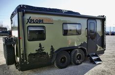 an off - road vehicle is parked in a parking lot