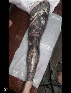 a man with a tattoo on his leg