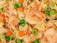 rice with shrimp, peas and carrots in a bowl