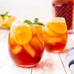 two glasses filled with iced tea and lemon slices